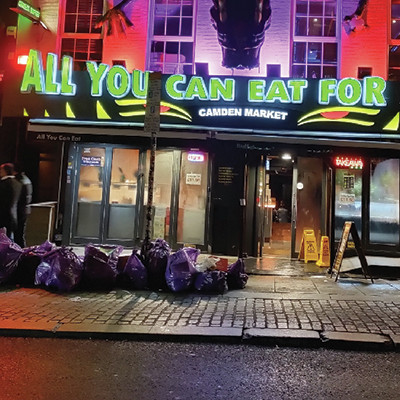 The response of a London eatery to rapidly rising prices in 2023: the sign says ' All you can eat for...' , leaving the price blank.